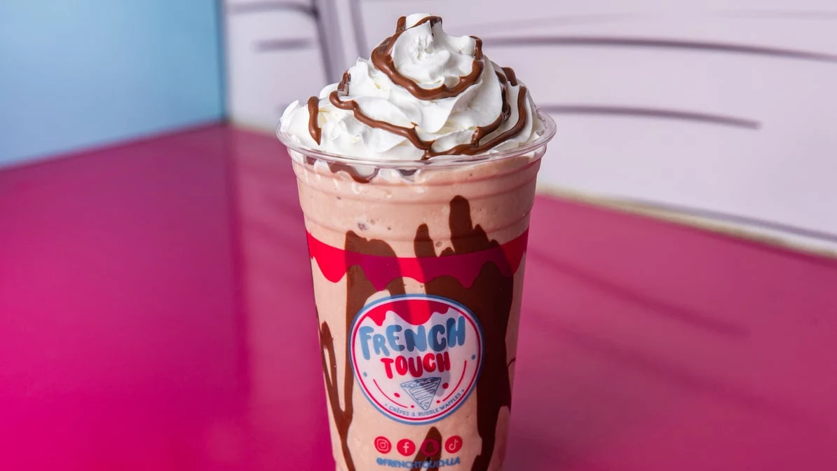 Authentic French crepe served on a plate with ice cream and chocolate sauce